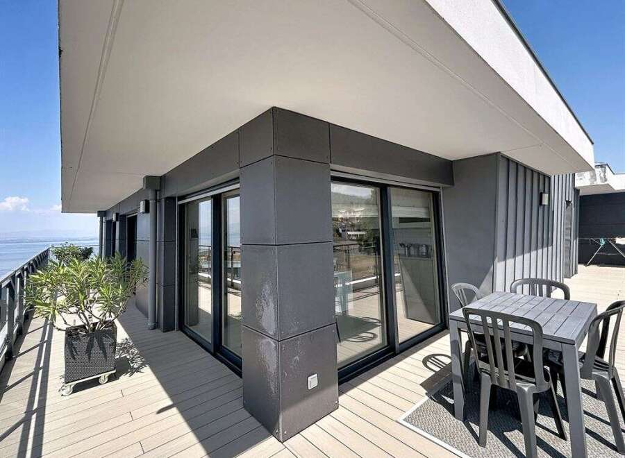 Enjoy breathtaking sea views from this modern balcony, perfect for al fresco dining or simply relaxing in the sun.