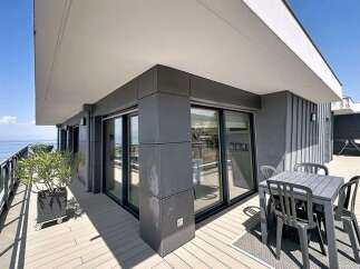 Enjoy breathtaking sea views from this modern balcony, perfect for al fresco dining or simply relaxing in the sun.