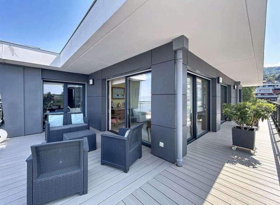 Enjoy breathtaking views from this modern apartment's spacious balcony, perfect for outdoor entertaining.