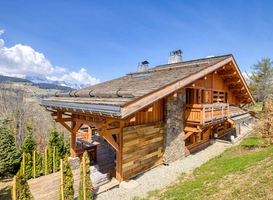 Experience the charm of this rustic wooden chalet nestled amidst breathtaking mountain scenery.