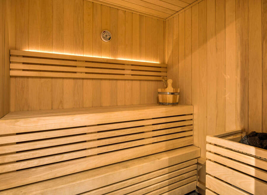 Experience ultimate relaxation in this beautifully crafted wooden sauna.
