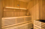 Experience ultimate relaxation in this beautifully crafted wooden sauna.