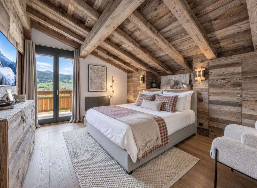 Experience luxurious mountain living in this stunning alpine bedroom.