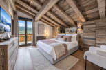 Experience luxurious mountain living in this stunning alpine bedroom.