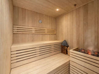 Experience ultimate relaxation in this beautifully crafted wooden sauna.
