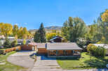 Experience mountain living in this charming log home, perfect for year-round enjoyment.