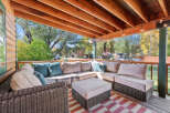 Enjoy the crisp autumn air on this spacious covered porch, perfect for relaxing or entertaining.