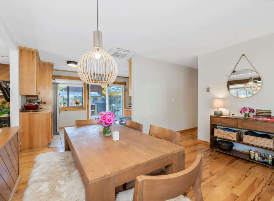 This dining area features a warm and inviting atmosphere with its natural wood elements and soft lighting.