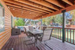 Enjoy outdoor living on this spacious covered porch, perfect for entertaining or relaxing.