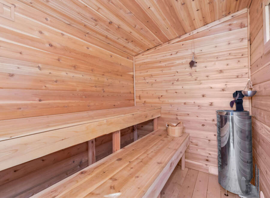 Experience ultimate relaxation in this beautifully crafted wooden sauna.