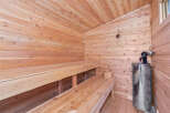 Experience ultimate relaxation in this beautifully crafted wooden sauna.