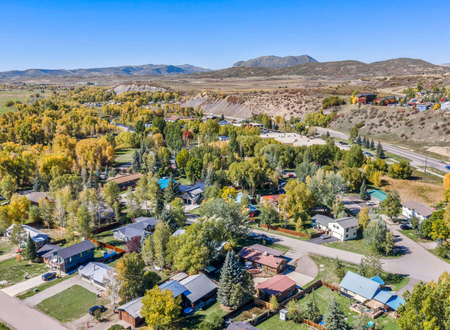 Discover this charming neighborhood nestled amidst vibrant autumn foliage and rolling hills.