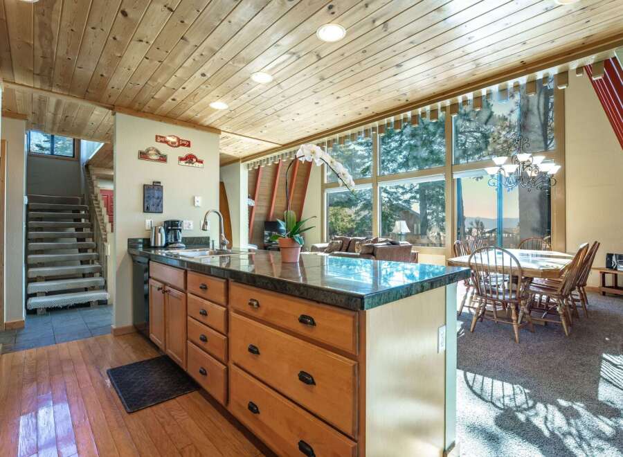 Experience the perfect blend of rustic charm and modern convenience in this inviting kitchen and dining area.