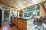Experience the perfect blend of rustic charm and modern convenience in this inviting kitchen and dining area.
