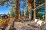Enjoy the stunning natural beauty from this expansive wooden deck, perfect for outdoor living and entertaining.
