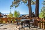 Enjoy breathtaking lake and mountain views from this charming deck, perfect for morning coffee or evening relaxation.