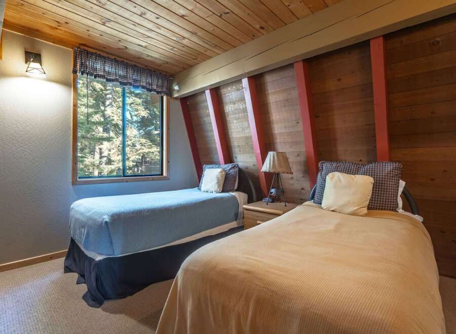 This charming bedroom features two comfortable beds, perfect for accommodating guests or family.
