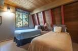This charming bedroom features two comfortable beds, perfect for accommodating guests or family.