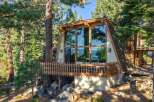 Experience the ultimate mountain retreat in this stunning A-frame cabin nestled amongst towering pine trees.