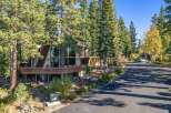 Nestled among tall pine trees, this unique A-frame home offers stunning natural beauty and modern comfort.