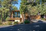 Nestled among tall pine trees, this unique A-frame home offers stunning natural beauty and modern living.