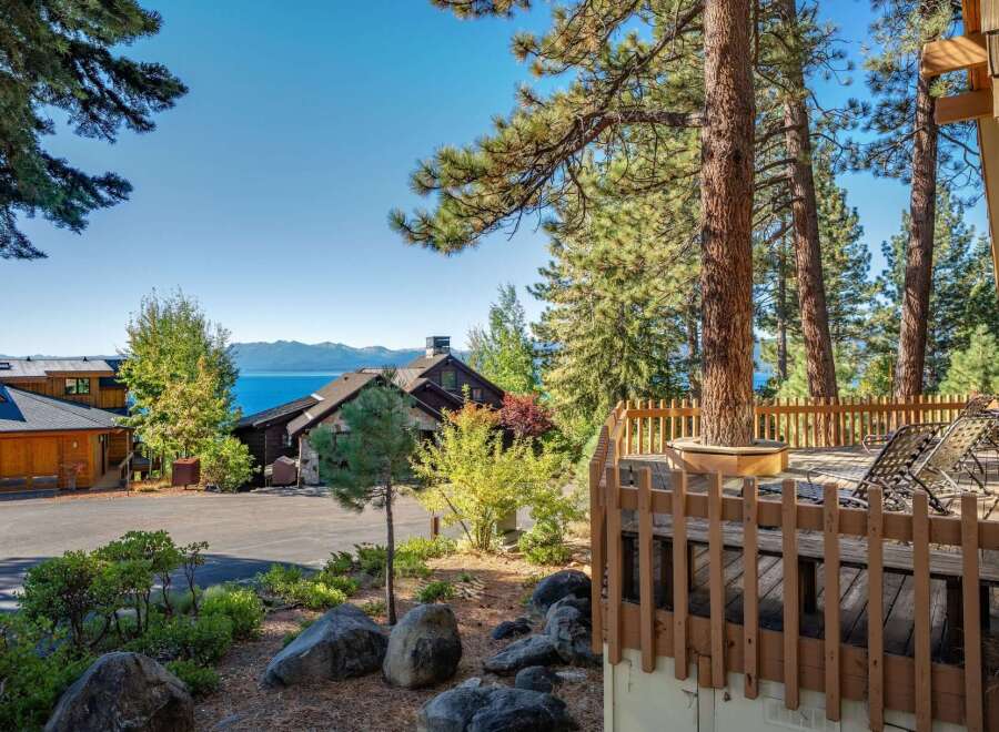 Experience breathtaking lake and mountain views from this stunning property, nestled amongst mature pine trees.