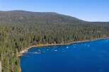 Experience the ultimate lakeside living with this stunning aerial view of a serene bay.