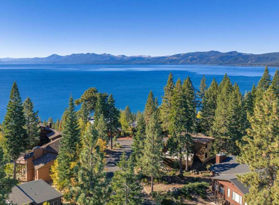 Experience breathtaking panoramic views of Lake Tahoe and the surrounding Sierra Nevada mountains from this stunning property.