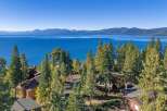 Experience breathtaking panoramic views of Lake Tahoe and the surrounding Sierra Nevada mountains from this stunning property.