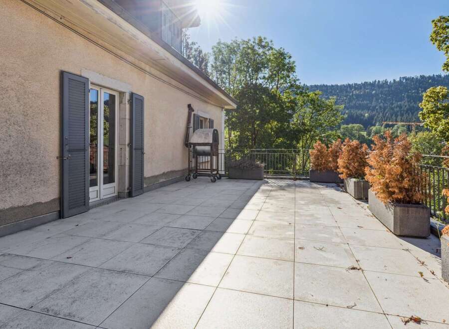 Enjoy outdoor living on this spacious patio, perfect for entertaining or relaxing.