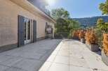 Enjoy outdoor living on this spacious patio, perfect for entertaining or relaxing.