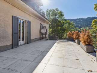 Enjoy outdoor living on this spacious patio, perfect for entertaining or relaxing.