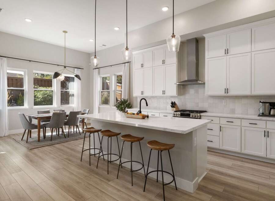 Experience modern living in this stunning open-concept kitchen and dining area.