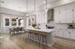 Experience modern living in this stunning open-concept kitchen and dining area.