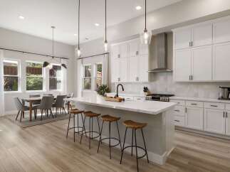 Experience modern living in this stunning open-concept kitchen and dining area.