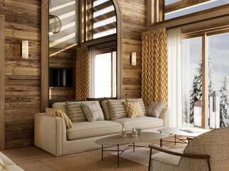 Experience ultimate luxury in this stunning mountain lodge living room, featuring a plush sofa and armchairs perfect for cozying up by the fire.
