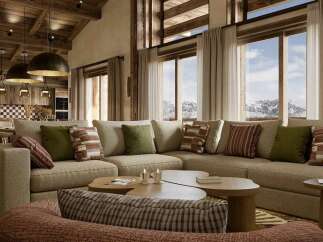 Experience luxurious mountain living in this stunning living room, featuring a spacious sectional sofa adorned with plush throw pillows and a cozy armchair.
