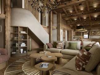 Experience luxury mountain living in this stunning chalet-style living room, featuring a grand wooden staircase and a cozy sectional sofa perfect for gathering.