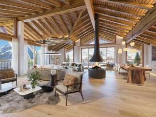 Experience luxury mountain living in this stunning open-concept living space, featuring a dramatic suspended fireplace and breathtaking panoramic views of snow-capped peaks.