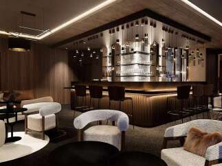 Experience luxury living in this sophisticated lounge area, featuring a stunning modern bar with ambient lighting and plush seating.