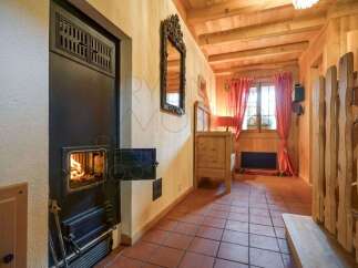 Experience cozy living with a charming wood-burning stove, perfect for warming up on chilly evenings.