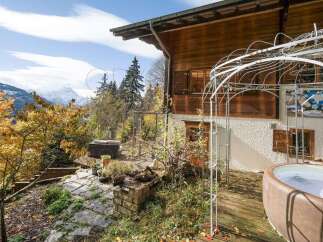 Experience the ultimate alpine retreat with this stunning property offering breathtaking mountain views and a luxurious outdoor living space.