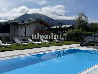 Enjoy a refreshing dip in this stunning outdoor swimming pool, perfect for relaxation and fun.