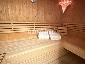 Experience ultimate relaxation in this beautifully crafted wooden sauna.