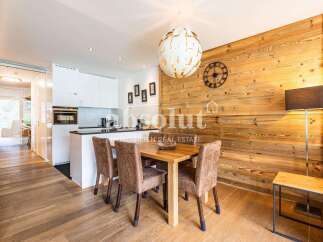 Experience modern living in this beautifully appointed apartment, featuring a sleek, contemporary kitchen with integrated appliances and ample counter space.