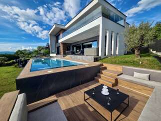 Experience luxury living in this modern villa featuring a stunning infinity pool and a spacious outdoor entertainment area.