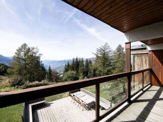Enjoy breathtaking mountain views from this stunning balcony, perfect for outdoor dining or simply relaxing in the fresh air.