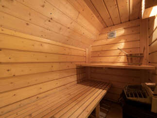 Experience ultimate relaxation in this beautifully crafted wooden sauna.