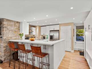 Experience the perfect blend of rustic charm and modern convenience in this beautifully appointed kitchen and living area.