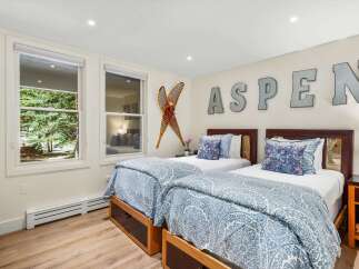 This charming bedroom features two comfortable twin beds, perfect for accommodating guests.